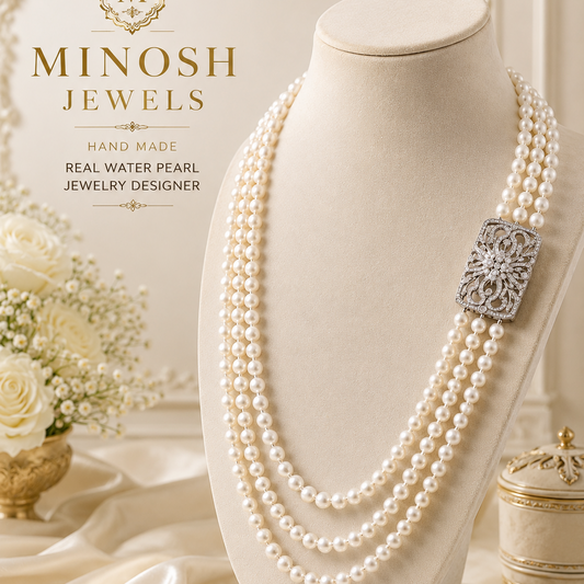 A Minosh Jewels multi-strand pearl necklace displayed on a cream jewelry bust. The necklace features five strands of white pearls with a decorative silver-toned square clasp.